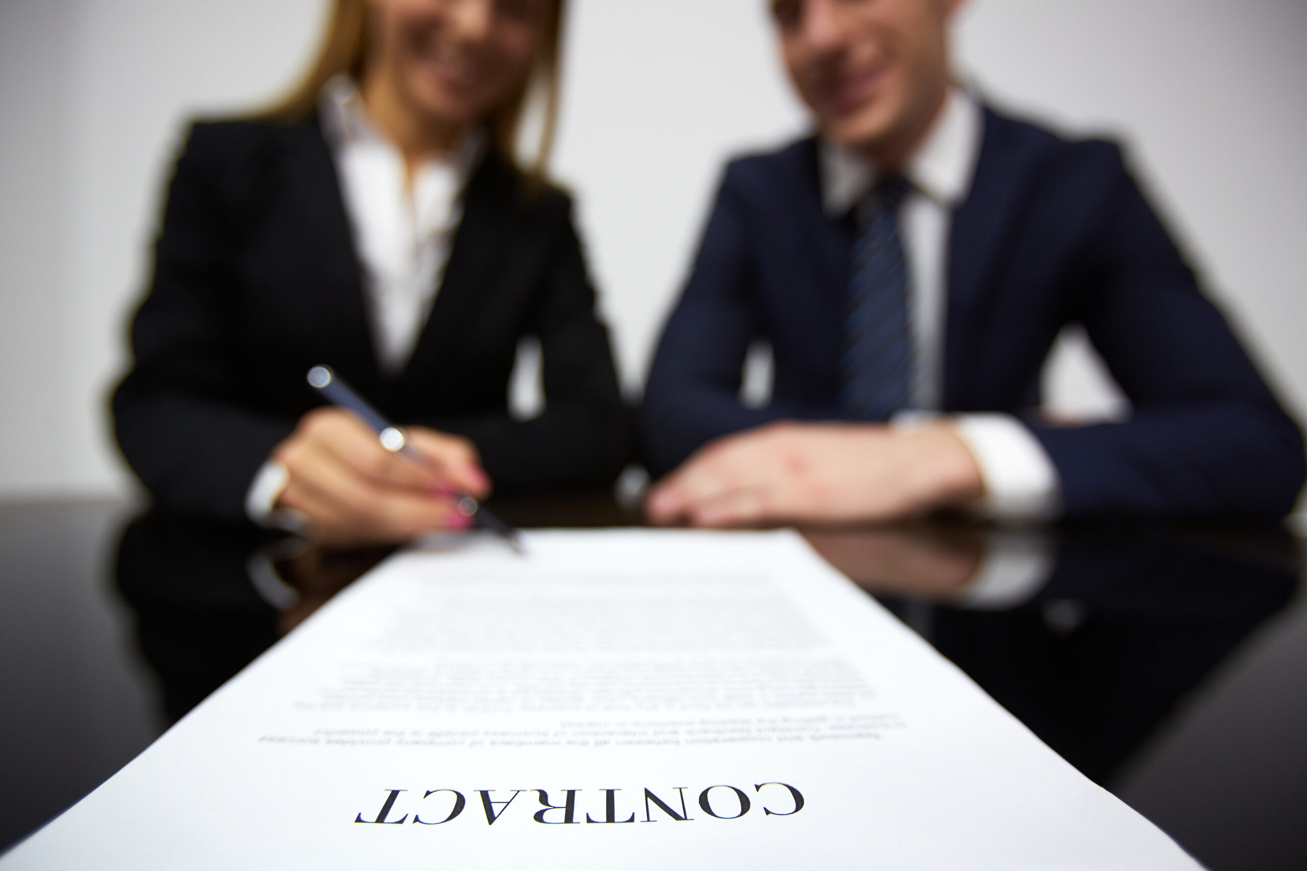 businesswoman signing new contract scaled